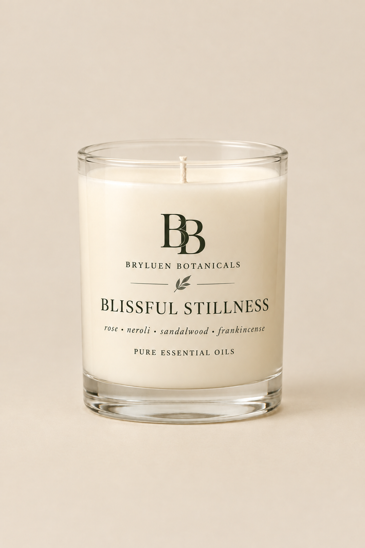 Blissful Stillness candle by Bryluen Botanicals in clear glass, unlit, with minimal transparent label