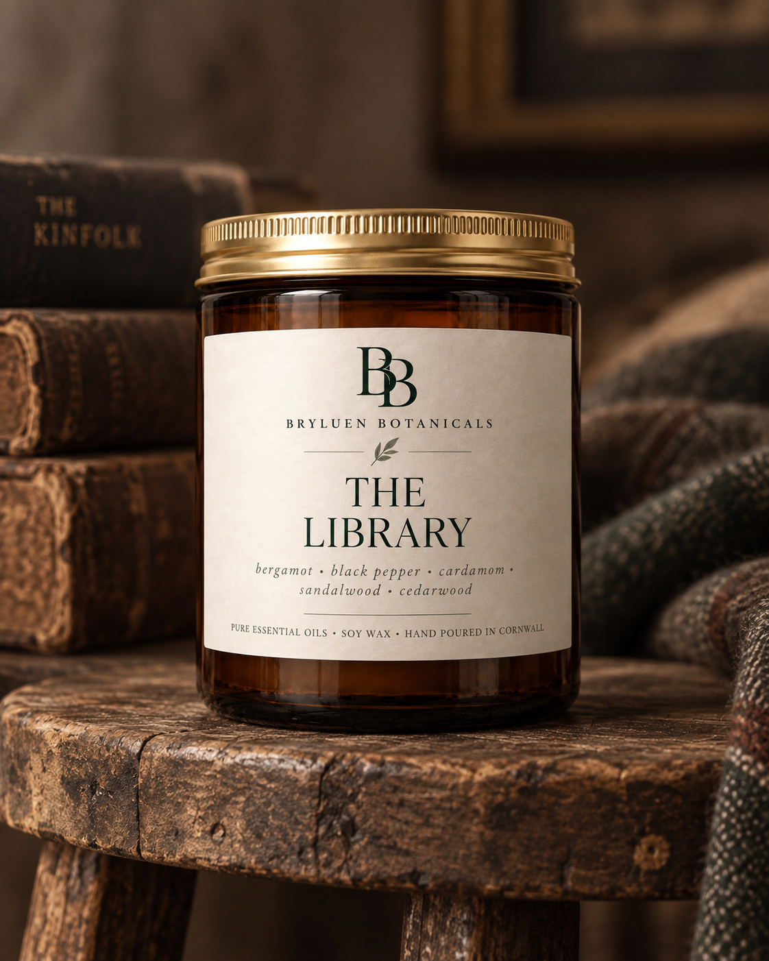 The Library natural soy wax candle by Bryluen Botanicals, photographed with antique books