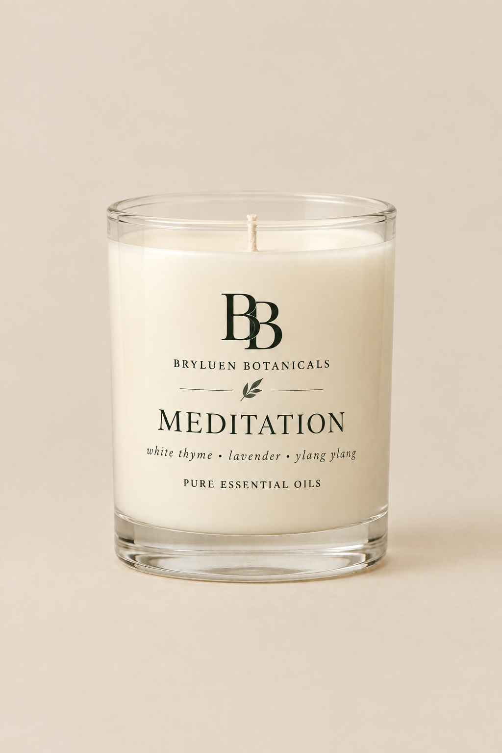 Meditation candle by Bryluen Botanicals in clear glass, unlit, with minimal transparent label