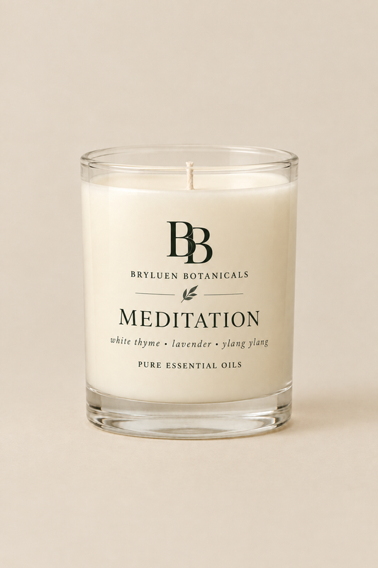 Meditation candle by Bryluen Botanicals in clear glass, unlit, with minimal transparent label